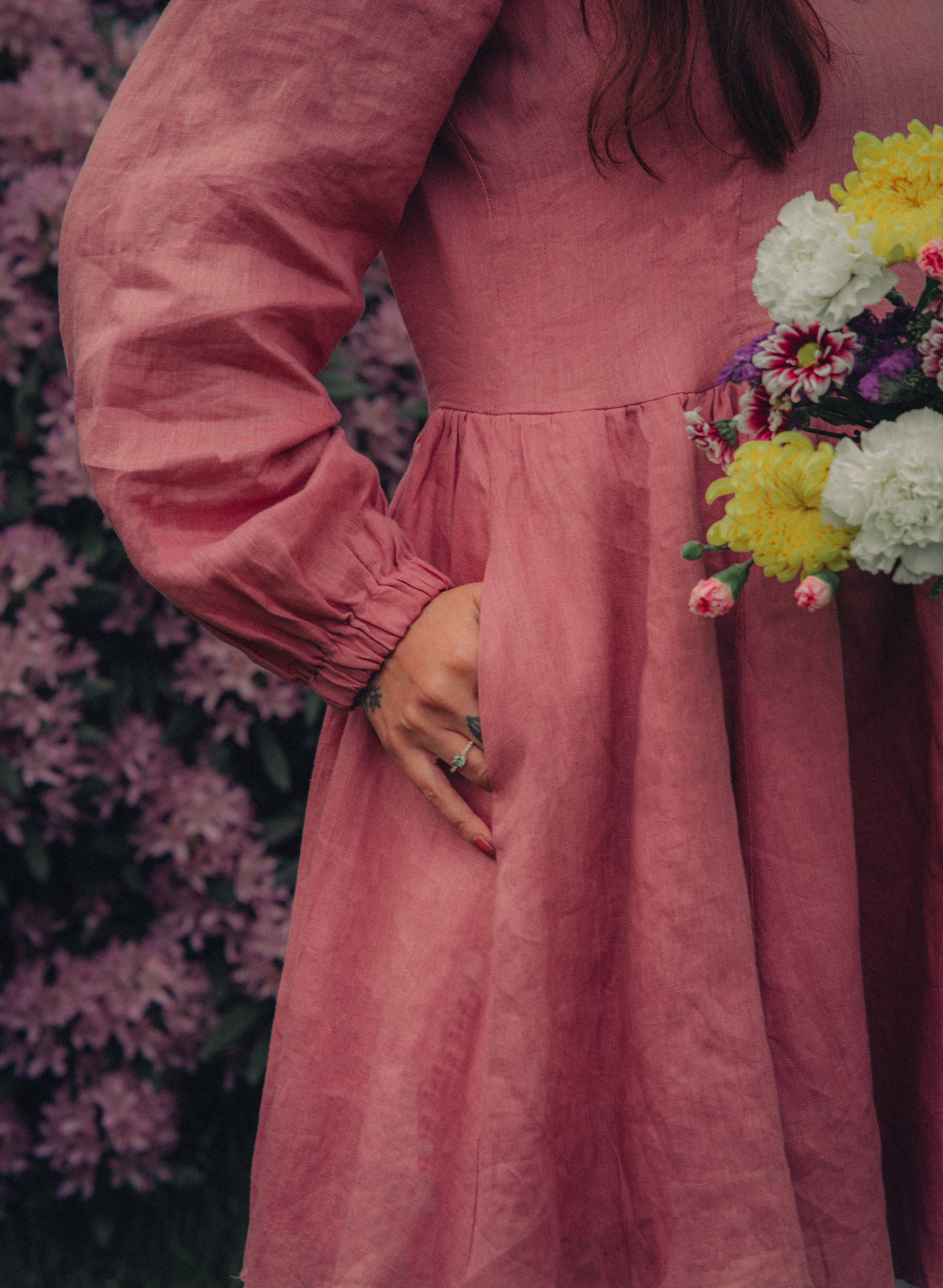 Soft pink long sleeve dress close up of pocket 